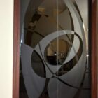 Porte vetro cristallo bronzo scorrevoli stipite legno decoro personalizzato kandinsky